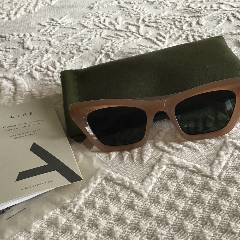 Aire Sunglasses in a warm beige color